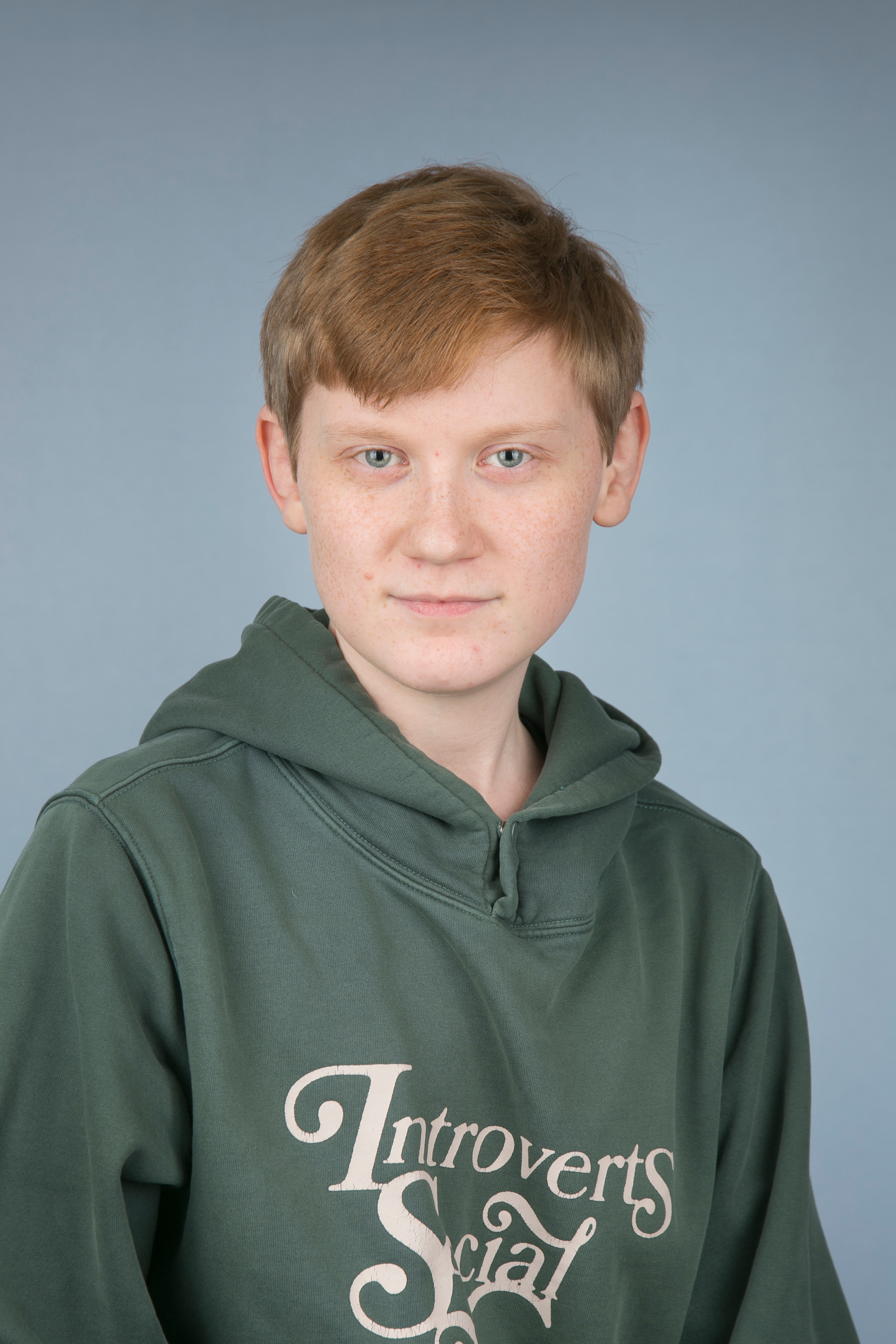 bilde av Christian Magnus Erbo Aspheim Rougthvedt. Blå øyne, kobberrødt hår og et lite smil.